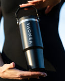 Black shaker bottle with 'VENOVA' branding held by a person against a blurred background