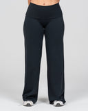 Black wide-leg pants worn by a person on a light gray background 