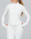 Person wearing a white outfit with a high collar on a gray background